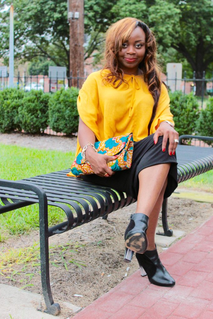 Mustard yellow cape top and black midi skirt