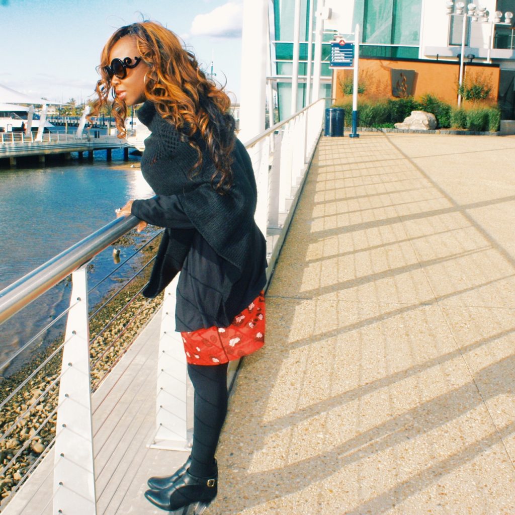 Red print dress with black sweater and poncho 2