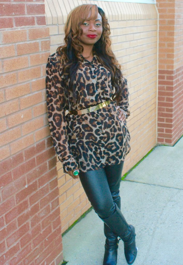 Long sleeve animal print top, gold belt and black leather pants