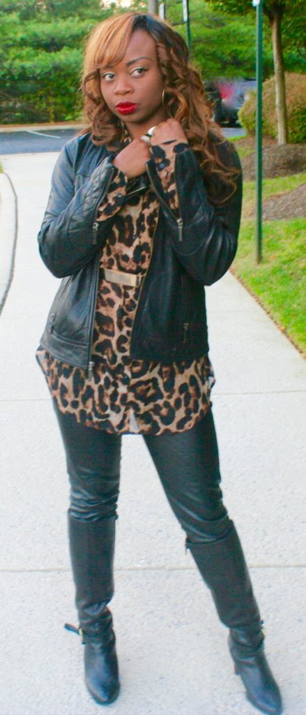 Long sleeve animal print top, gold belt, black leather pants & jacket