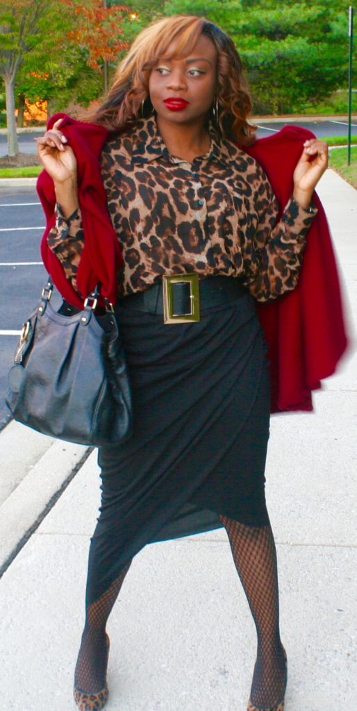 Animal print top, black asymmetrical wrap skirt, red cape, Gucci bag