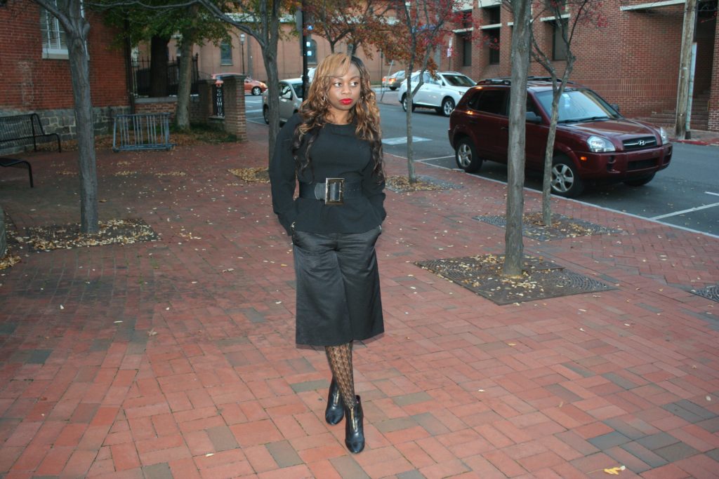 Black peplum top with bow, black culottes and black boots