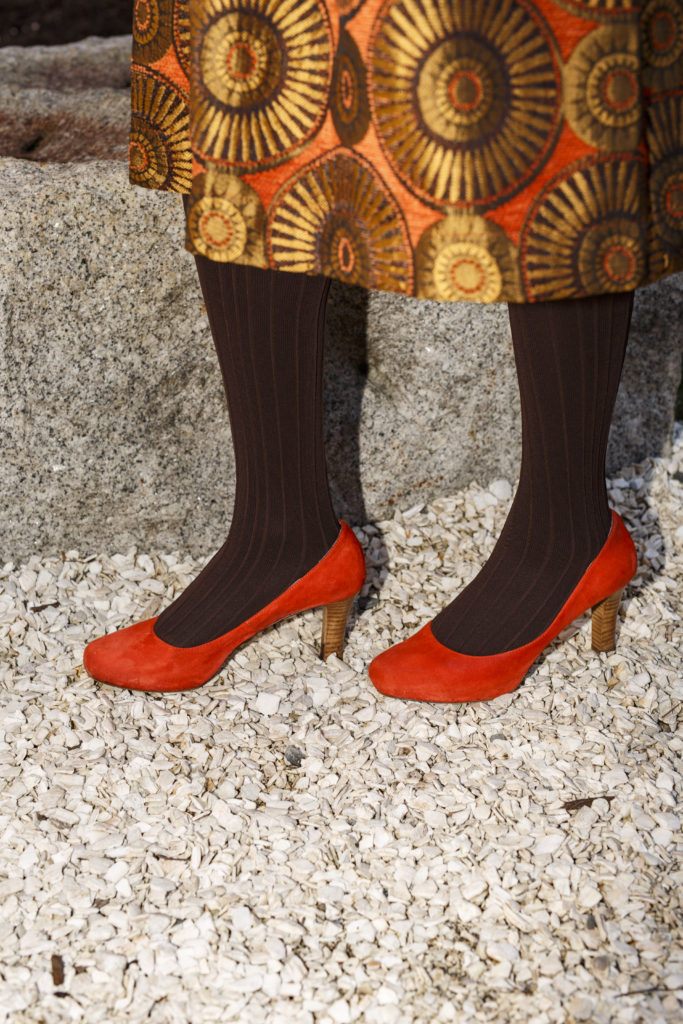 Brown tights and orange pumps