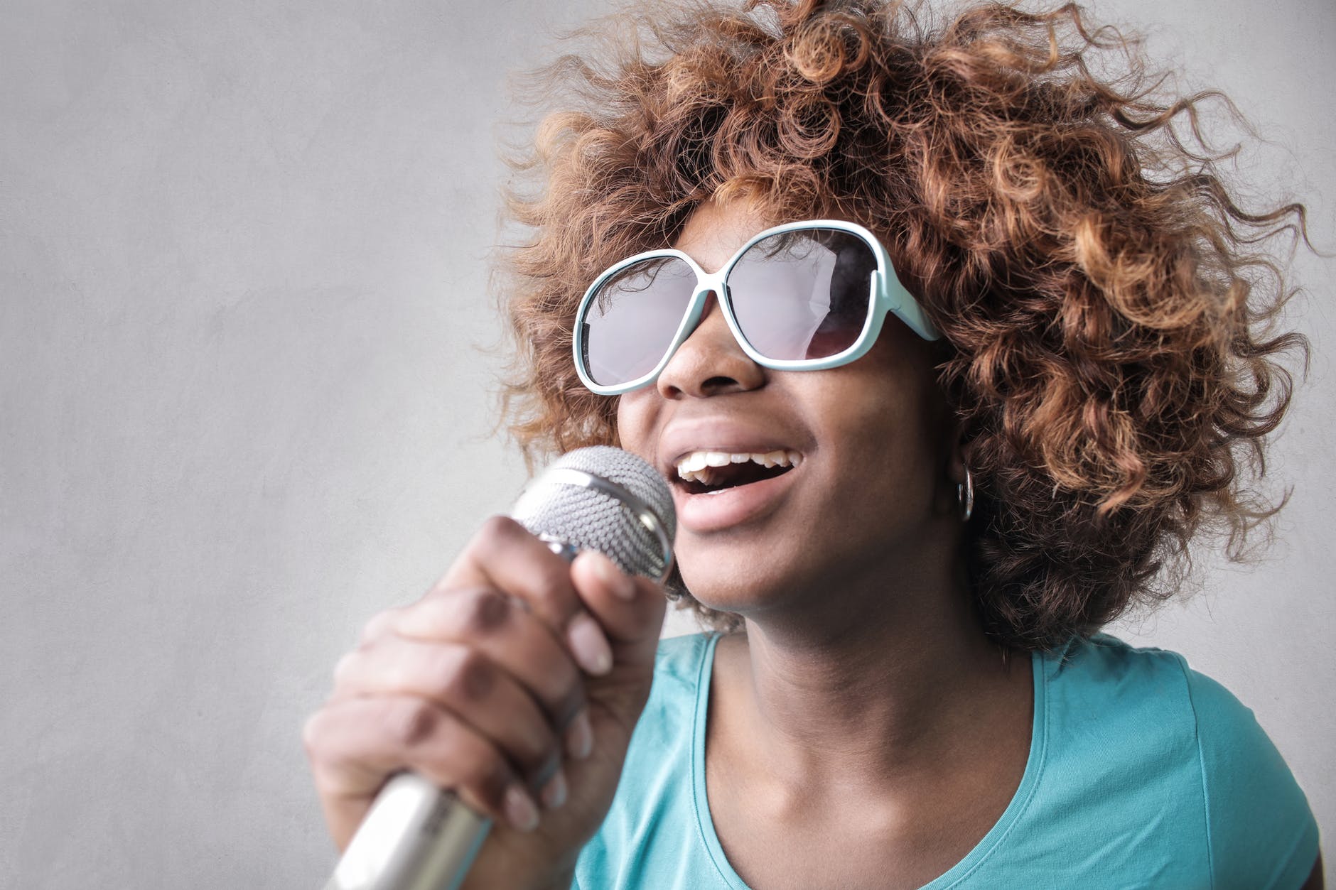 woman holding microphone