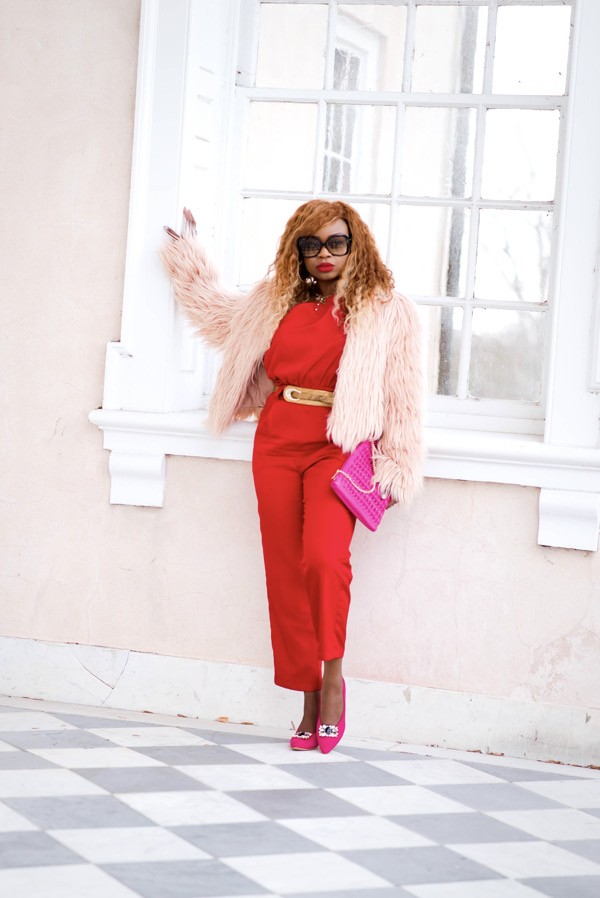 Red Express draped shoulder jumpsuit and bright pink pumps